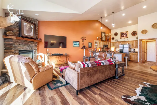 a kitchen with stainless steel appliances granite countertop a sink and a stove