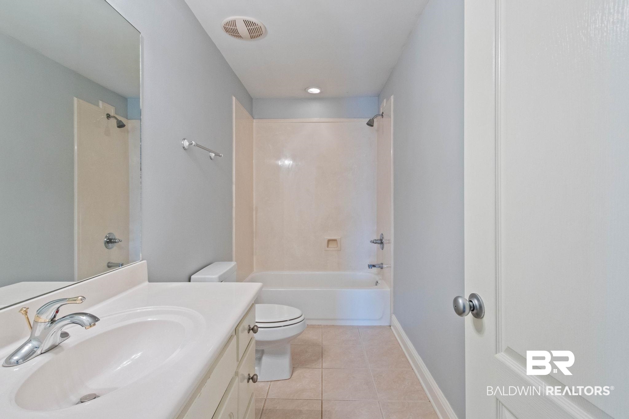 3176 Cedar Court Mobile, AL 36619 - Photo 30 of 33 Bathroom featuring a white vanity with integrated sink, chrome faucet, and white cabinetry