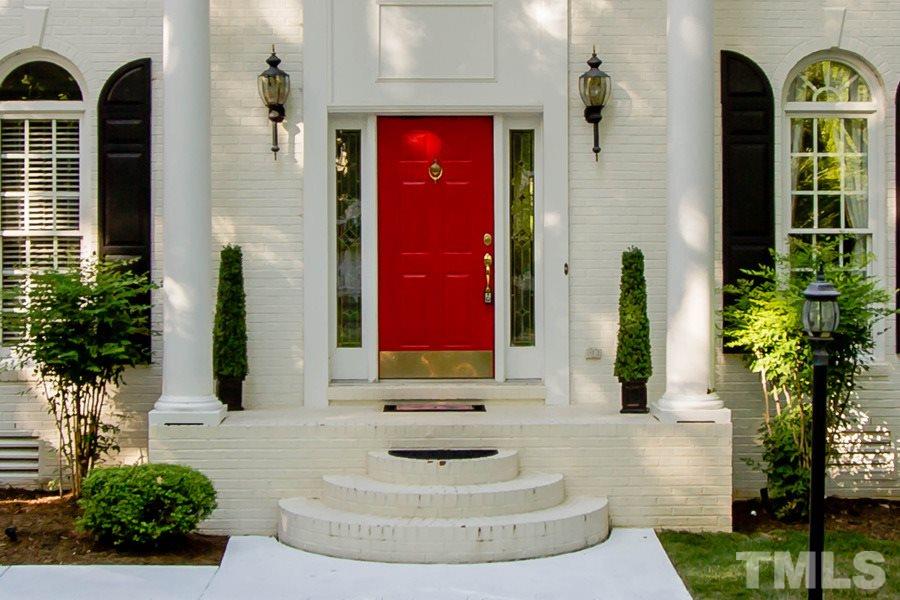 6324 Battleview Drive Raleigh, NC 27613 - Photo 2 of 25 a view of a house with potted plants and a fountain