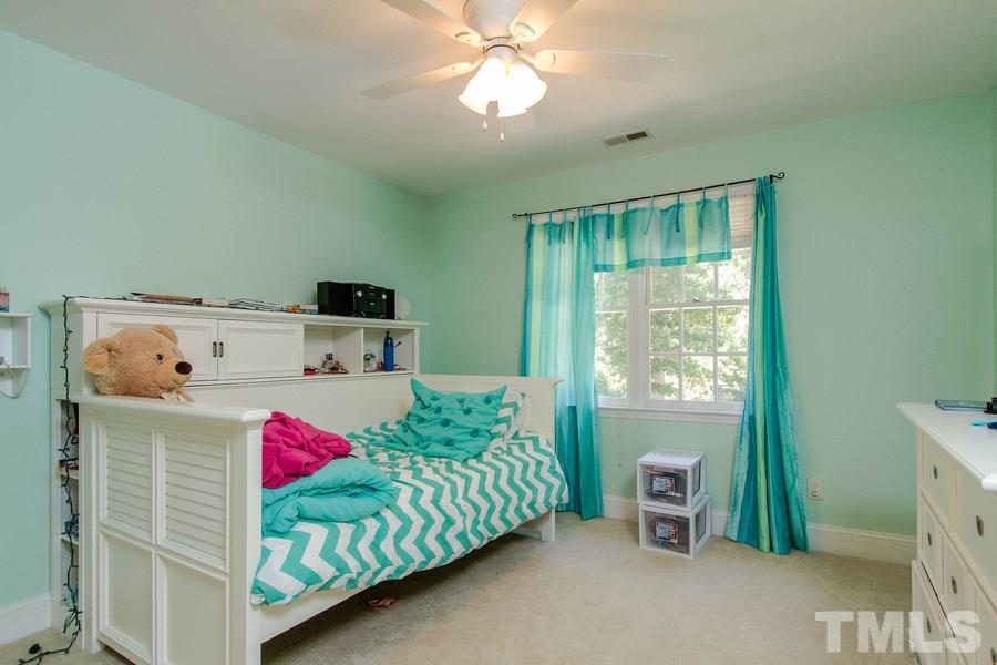 6324 Battleview Drive Raleigh, NC 27613 - Photo 17 of 25 a bedroom with a bed and a window
