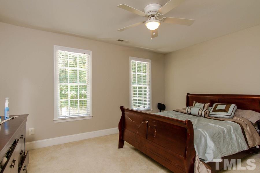 6324 Battleview Drive Raleigh, NC 27613 - Photo 19 of 25 a bedroom with a bed and window