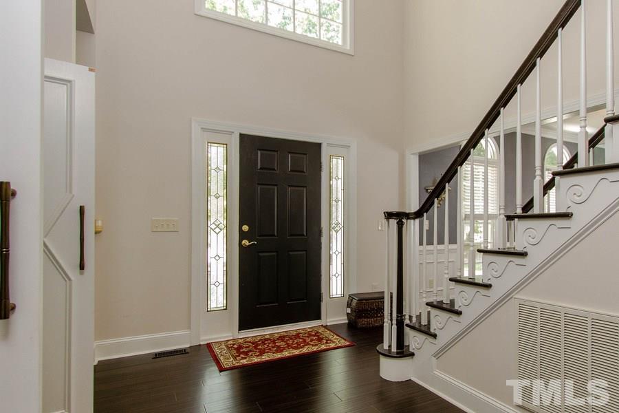 6324 Battleview Drive Raleigh, NC 27613 - Photo 3 of 25 a view of entryway with wooden floor and stairs