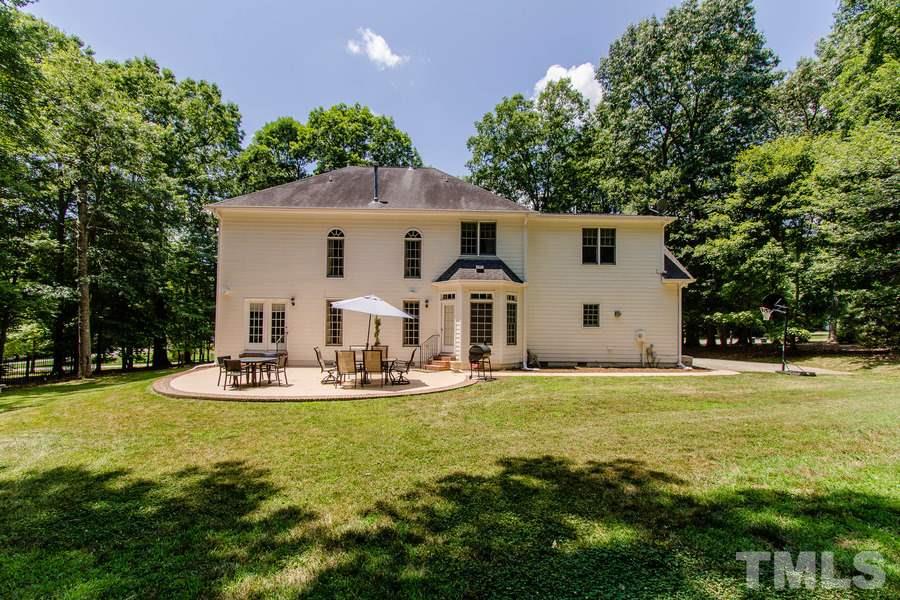 6324 Battleview Drive Raleigh, NC 27613 - Photo 24 of 25 a view of a house with backyard and sitting area