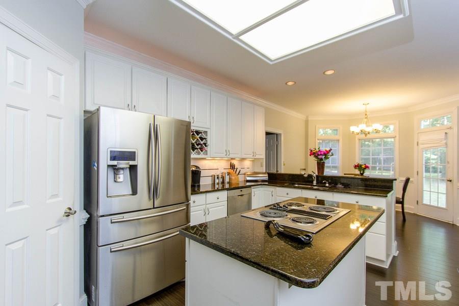 6324 Battleview Drive Raleigh, NC 27613 - Photo 10 of 25 a kitchen with a appliances a sink and a refrigerator