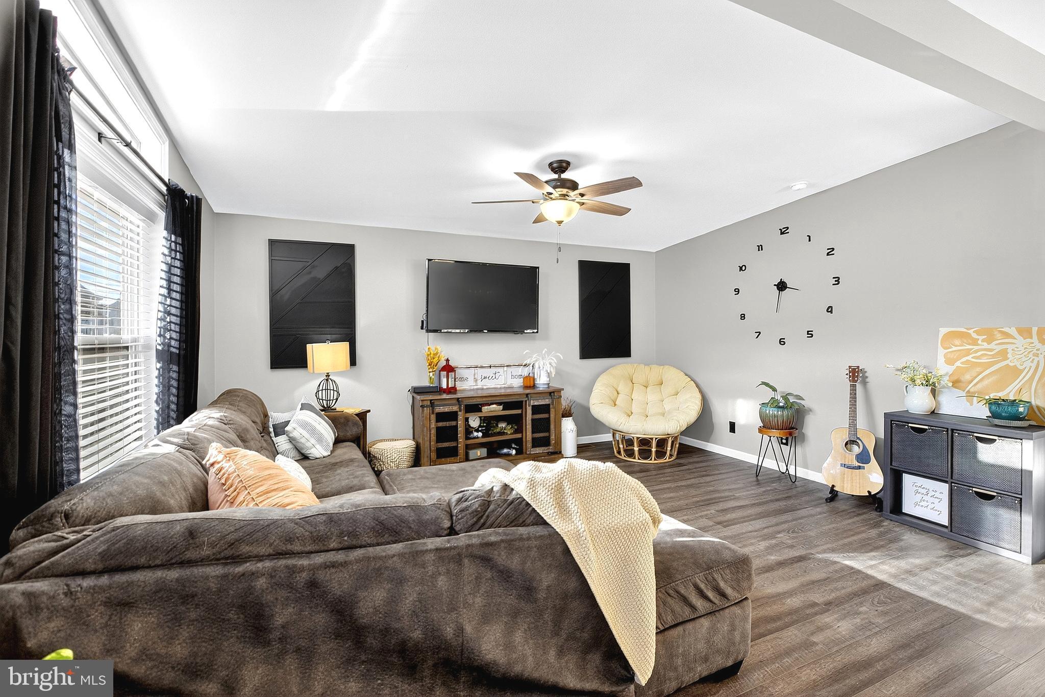 108 West Commerce Street Kenton, DE 19938 - Photo 12 of 48 a living room with furniture and a flat screen tv