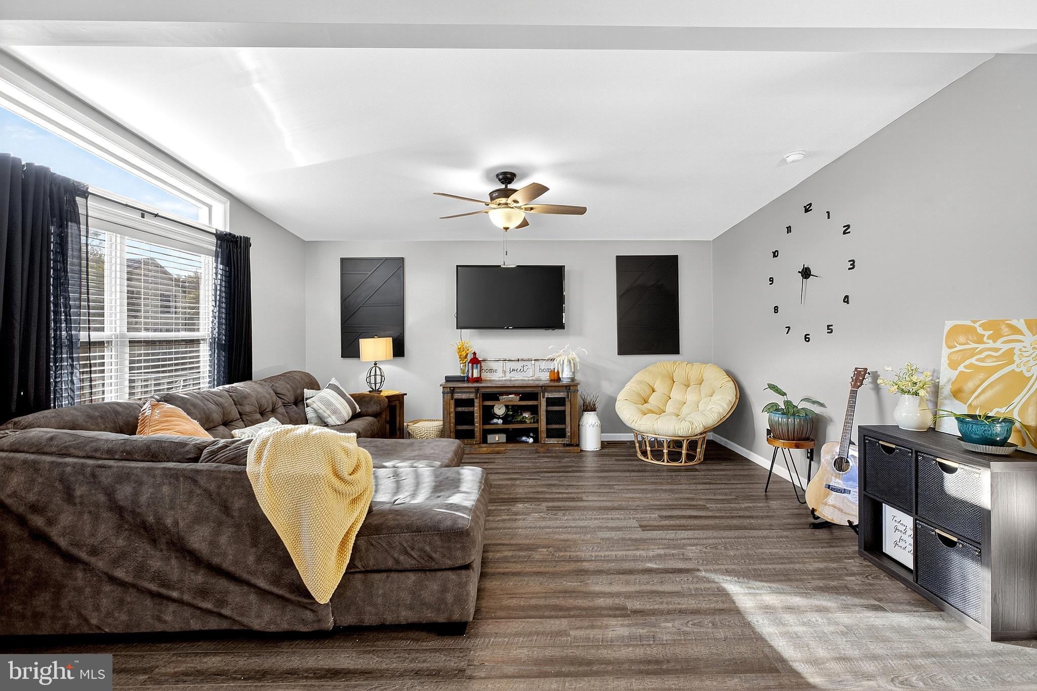 108 West Commerce Street Kenton, DE 19938 - Photo 13 of 48 a living room with furniture and a flat screen tv