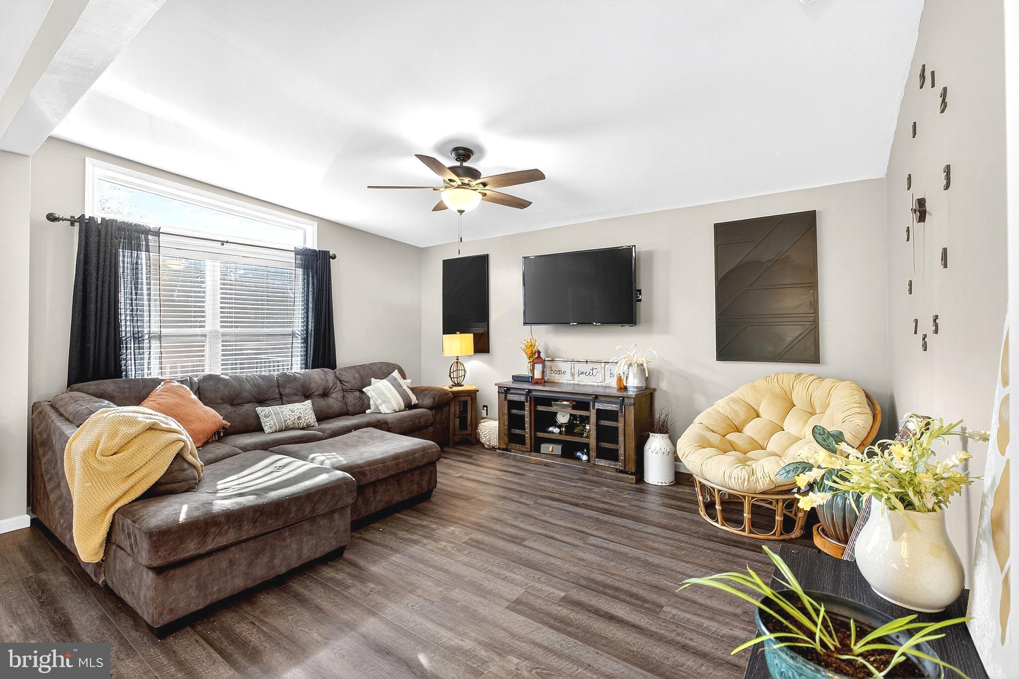 108 West Commerce Street Kenton, DE 19938 - Photo 14 of 48 a living room with furniture fireplace and a flat screen tv