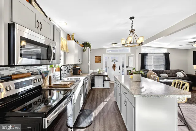 a bathroom with a sink a mirror and a shower