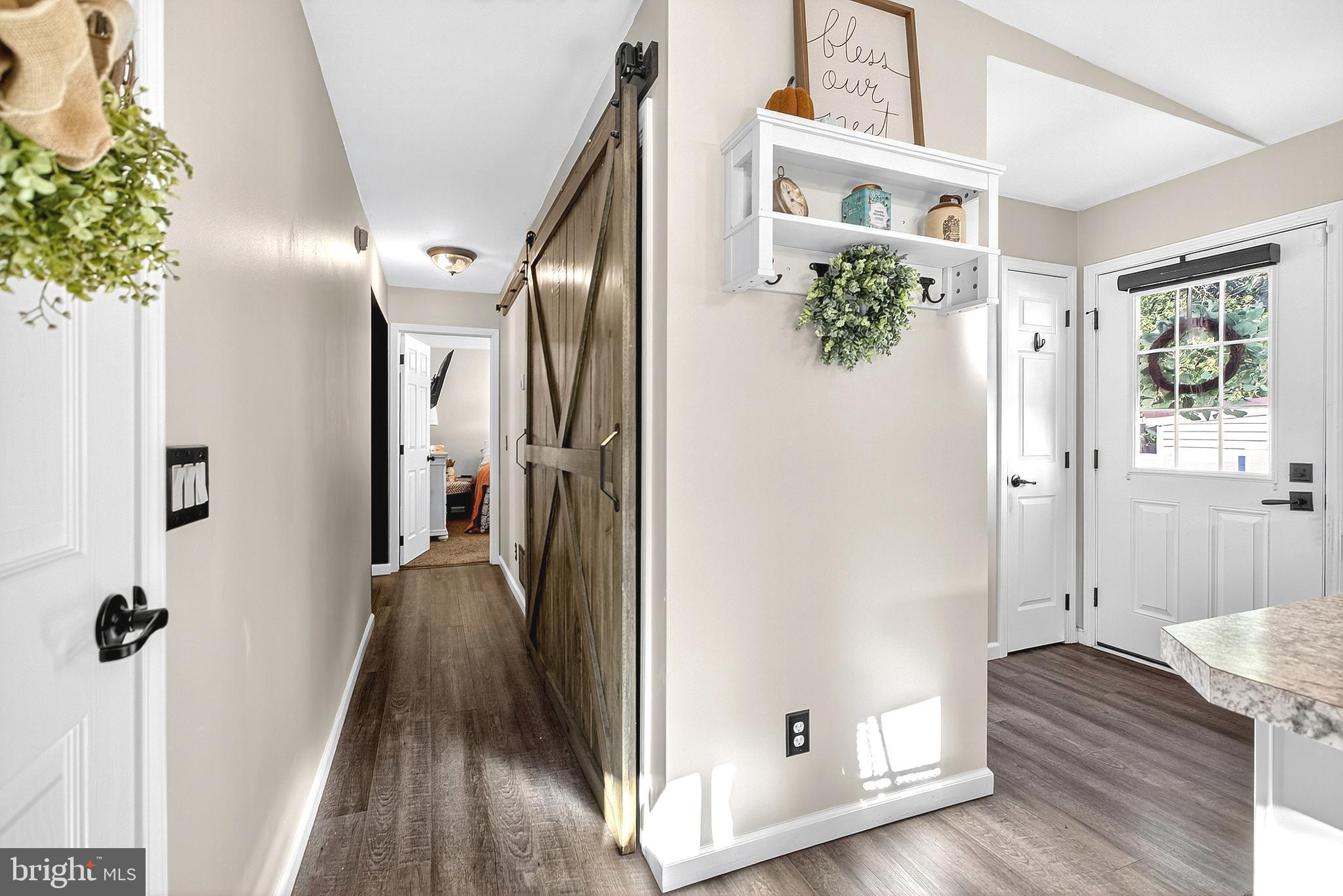 108 West Commerce Street Kenton, DE 19938 - Photo 23 of 48 a view of a hallway with wooden floor and staircase