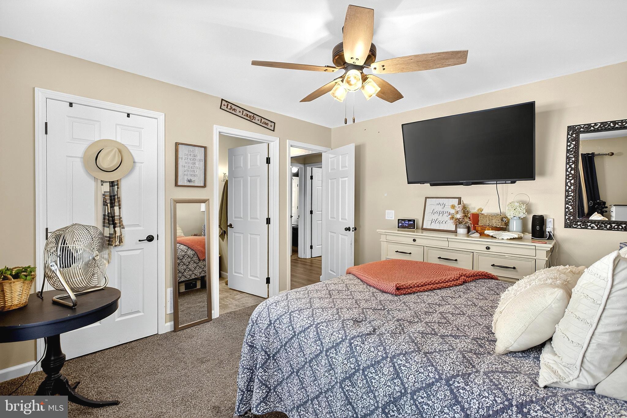 108 West Commerce Street Kenton, DE 19938 - Photo 26 of 48 a bedroom with a bed and a chandelier