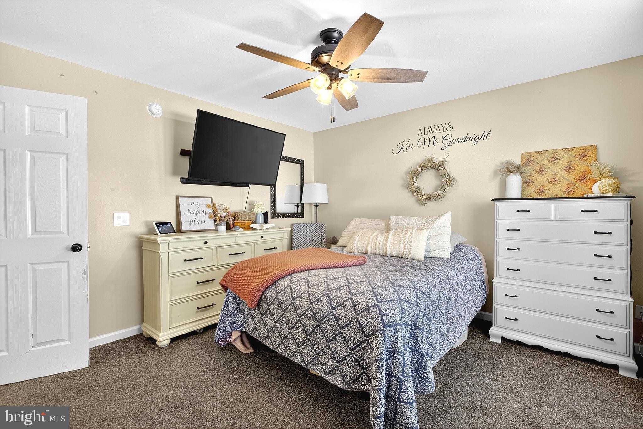 108 West Commerce Street Kenton, DE 19938 - Photo 28 of 48 a bedroom with a bed and a flat screen tv