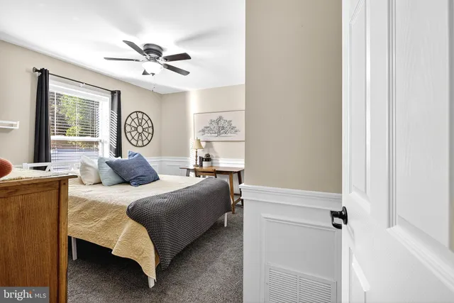 a view of yard with swimming pool and trees