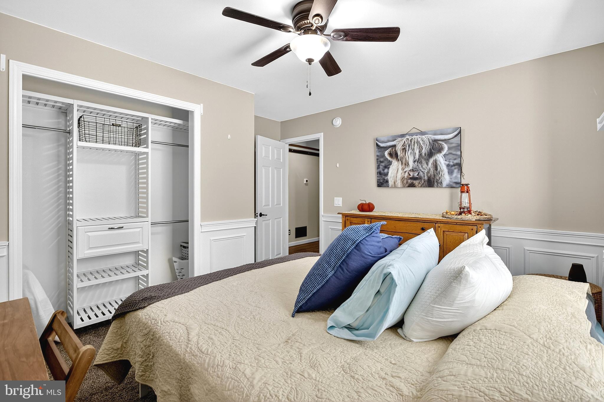 108 West Commerce Street Kenton, DE 19938 - Photo 33 of 48 a bedroom with a bed and wooden floor