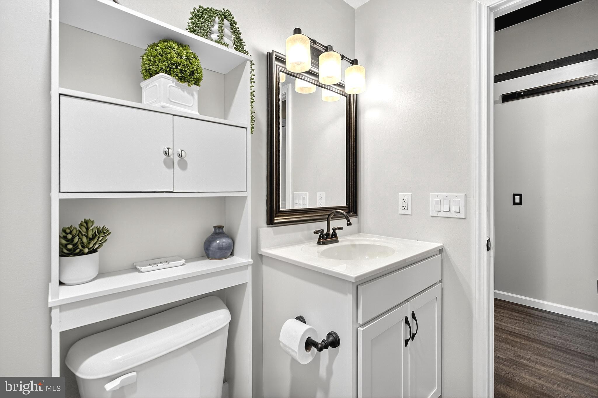 108 West Commerce Street Kenton, DE 19938 - Photo 36 of 48 a bathroom with a sink and a mirror