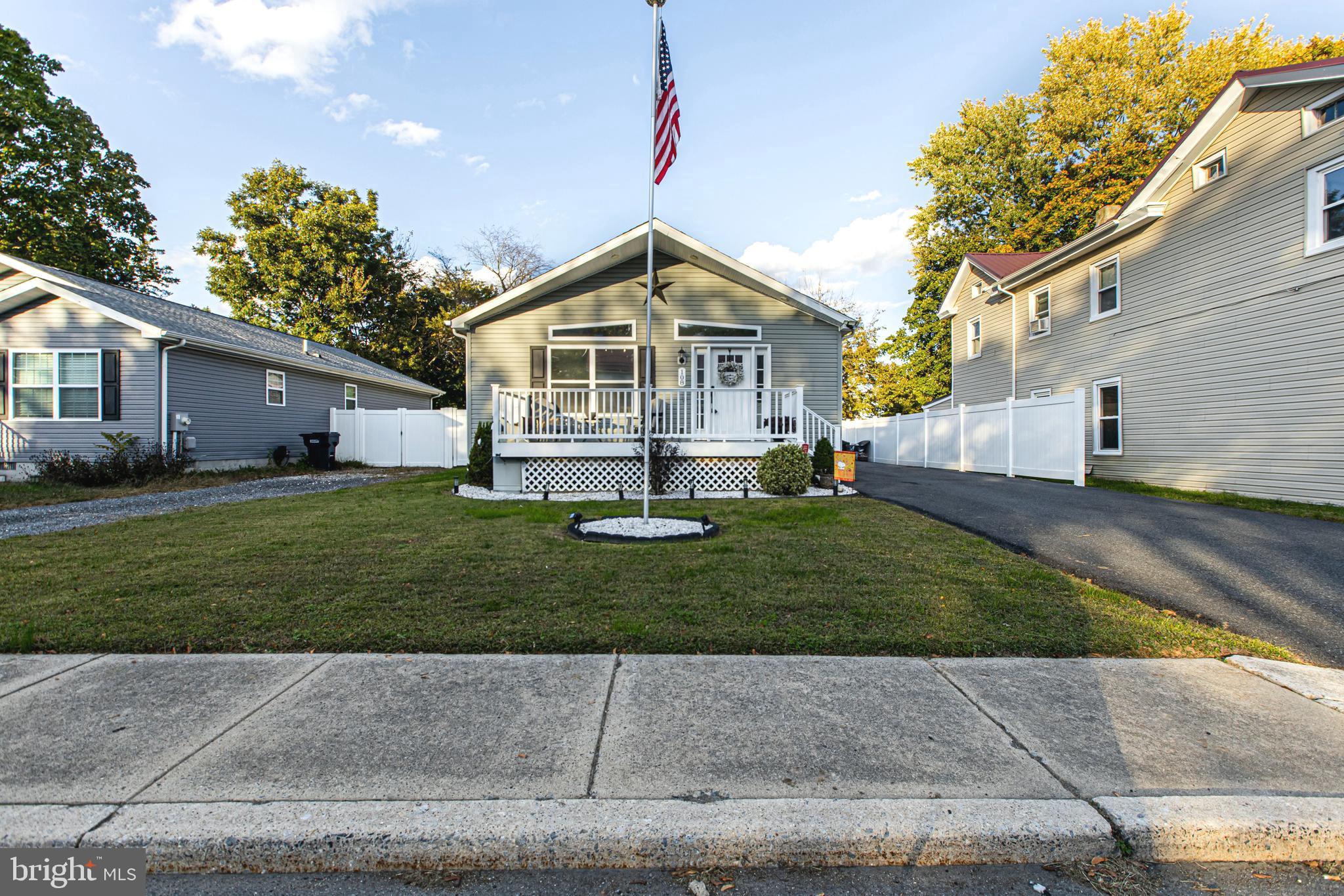 108 West Commerce Street Kenton, DE 19938 - Photo 4 of 48 a front view of a house with a yard and trees
