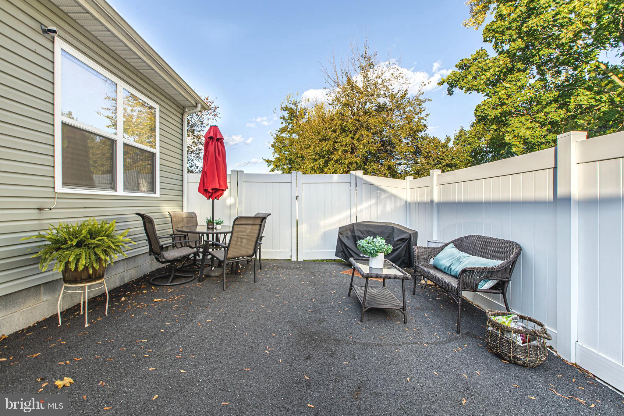 108 West Commerce Street Kenton, DE 19938 - Photo 48 of 48 a backyard of a house with table and chairs
