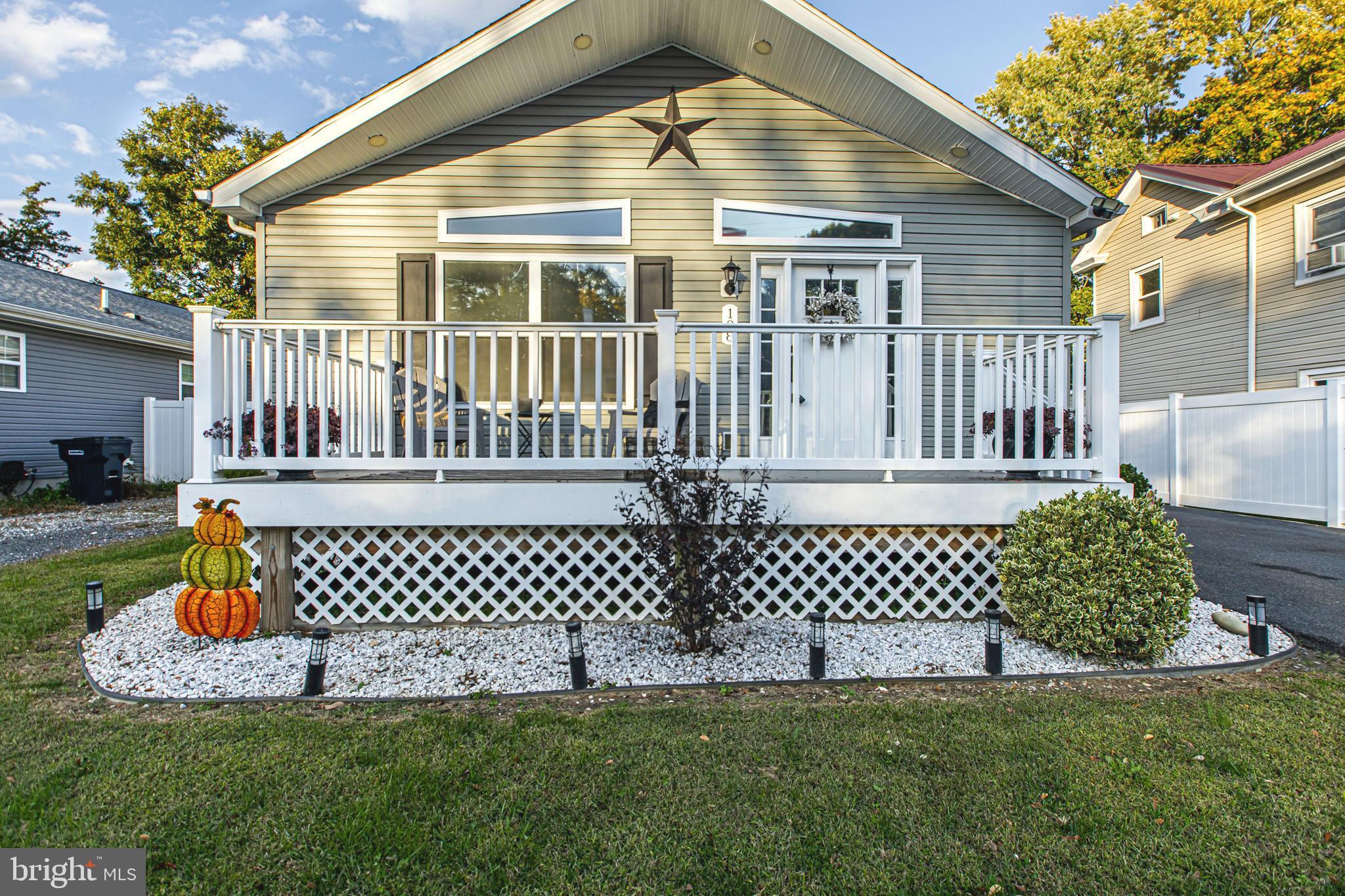 108 West Commerce Street Kenton, DE 19938 - Photo 5 of 48 a front view of a house with a garden