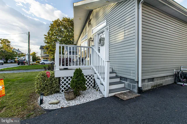 a living room with lots of furniture and a chandelier