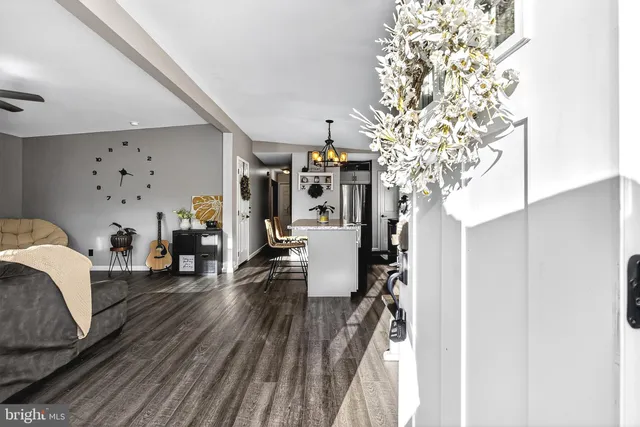 a living room with furniture fireplace and a flat screen tv