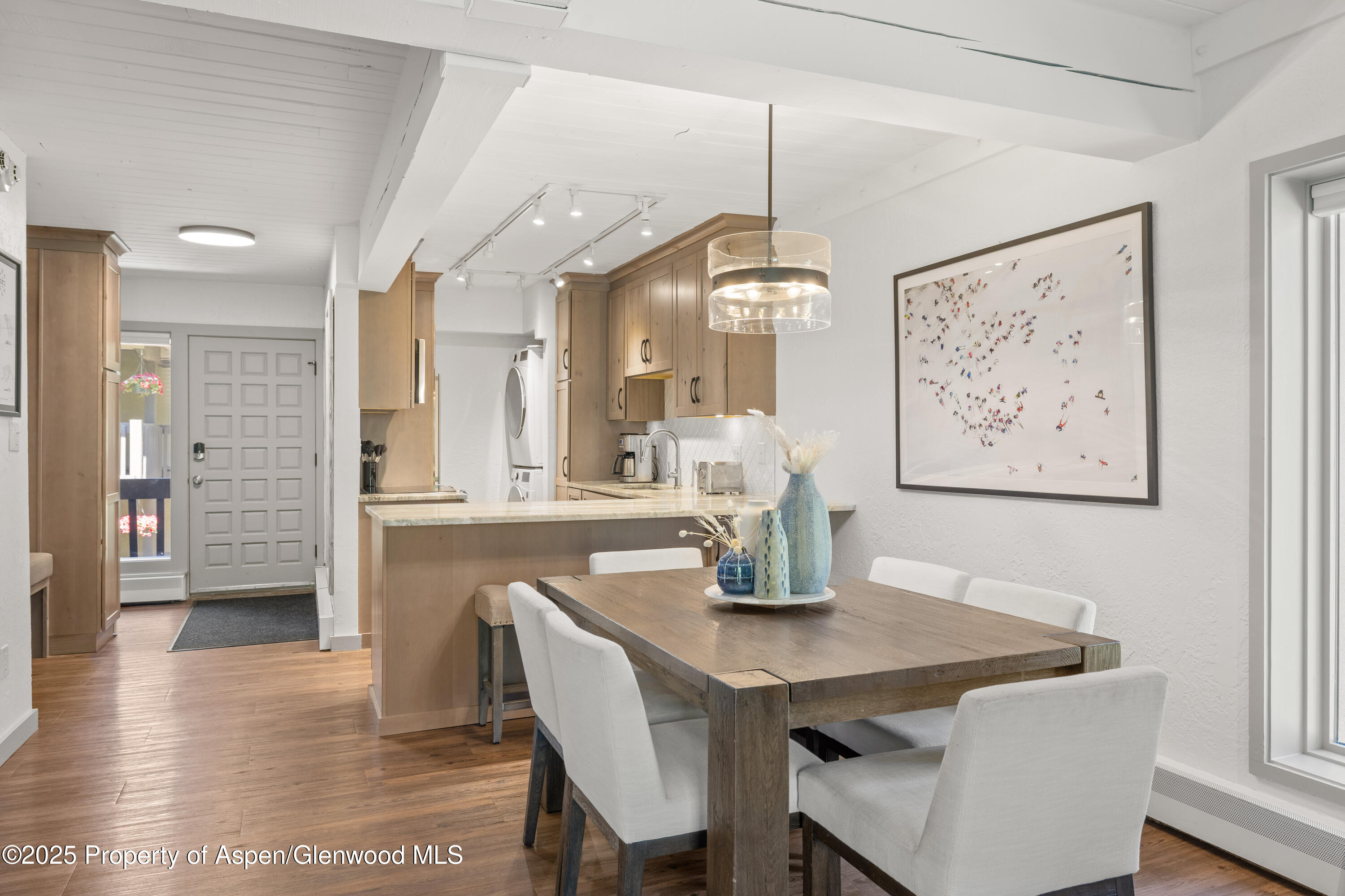 70 Gallun Lane, Unit 206B Snowmass Village, CO 81615 - Photo 5 of 15 a view of a dining room with furniture and wooden floor