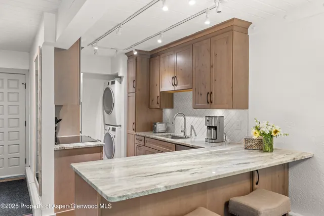 a kitchen with refrigerator and countertop