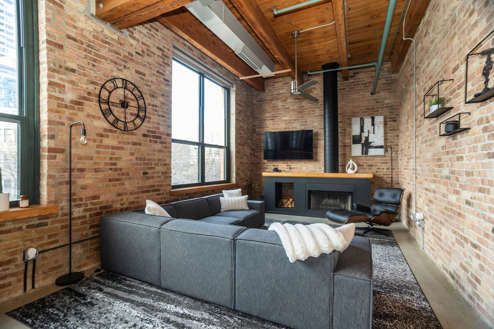 1727 South Indiana Avenue, Unit 201 Chicago, IL 60616 - Photo 2 of 12 a living room with furniture and a fireplace