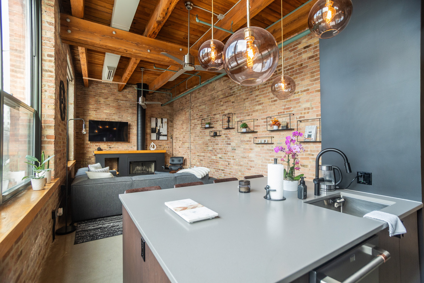 1727 South Indiana Avenue, Unit 201 Chicago, IL 60616 - Photo 7 of 12 a dining room with furniture a large window and a fireplace