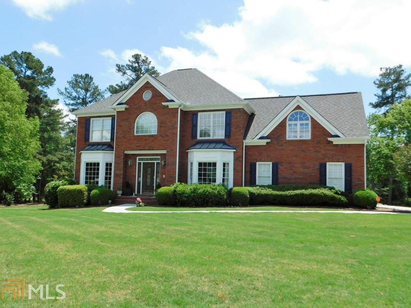 Custom Built Home at 9810 Linkside Pointe is situated on a great golf course lot with a fantastic lake view