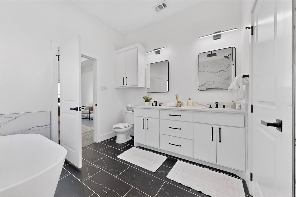 4464 Key Ranch Road Trinidad, TX 75163 - Photo 22 of 40 Bathroom with a freestanding bath, double vanity, and dark marble finish flooring