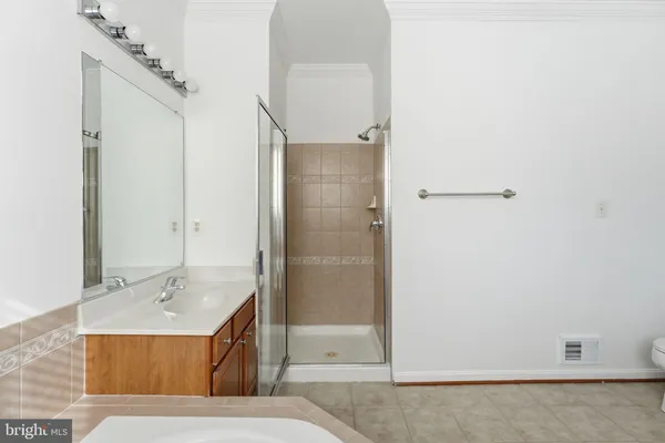 a bathroom with a bathtub and shower