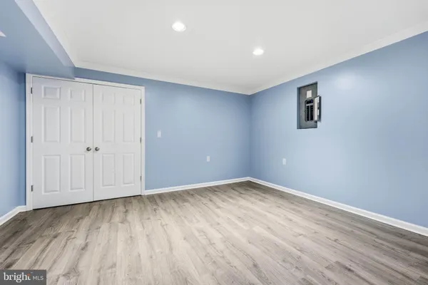 an empty room with wooden floor