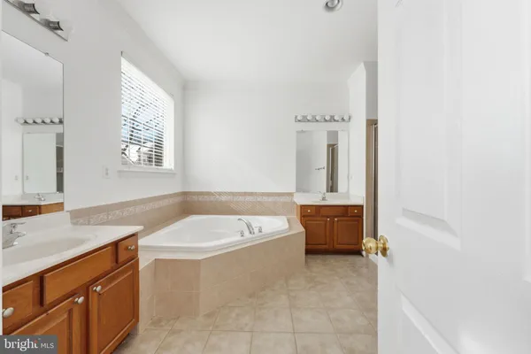 a bathroom with a bathtub and a sink