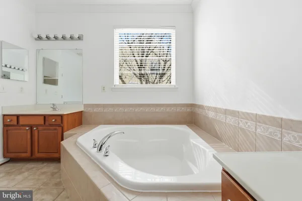 a bathroom with a bathtub and a sink