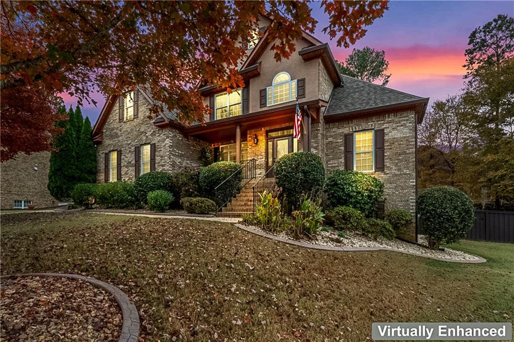 1615 Avery Drive Locust Grove, GA 30248 - Photo 3 of 49 a front view of a house with garden