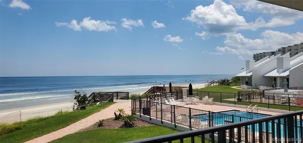 a view of swimming pool with a patio