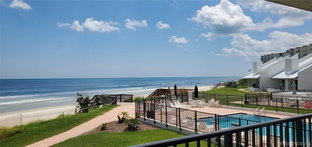 a view of swimming pool with a patio