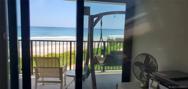 a view of a patio with a bench