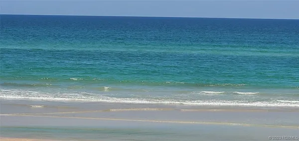 a view of a roof deck with dining table and chair a barbeque with wooden floor