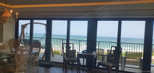 a bedroom with a bed and a lamp on table