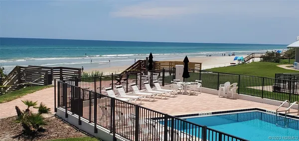 a view of a balcony with chairs