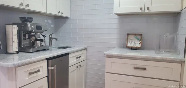 a dining room with wooden floor table and chairs