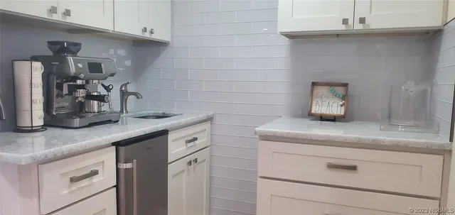 a dining room with wooden floor table and chairs