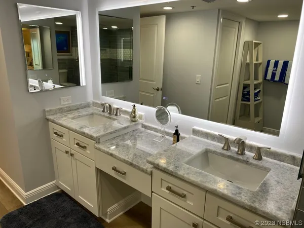 a kitchen with stainless steel appliances granite countertop a refrigerator sink and stove