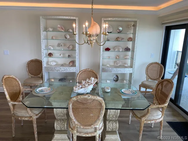 a kitchen with granite countertop white cabinets and stainless steel appliances