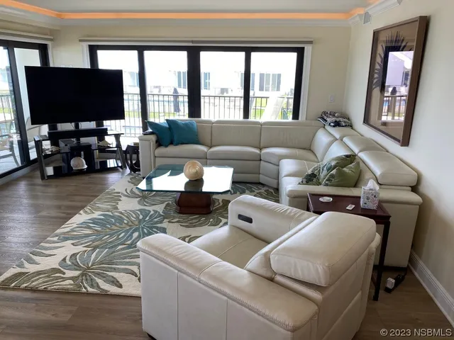 a kitchen with stainless steel appliances a refrigerator stove and microwave