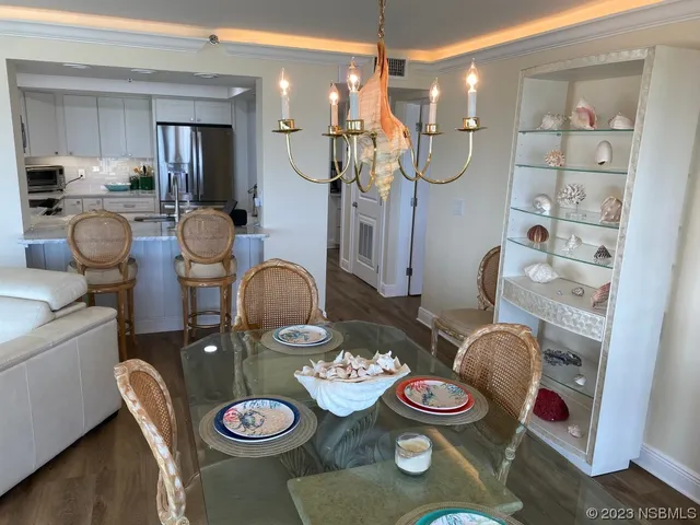 a kitchen with granite countertop white cabinets and sink