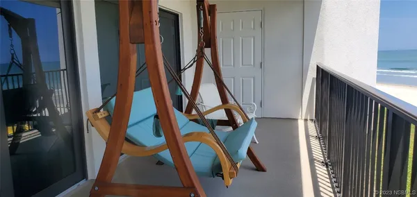 a living room with furniture and flat screen tv