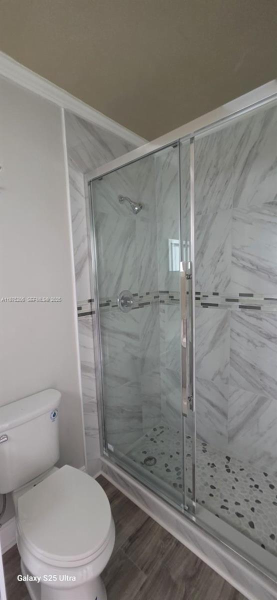 1340 Northwest 133rd Street Miami, FL 33167 - Photo 20 of 31 a white toilet and shower in a bathroom