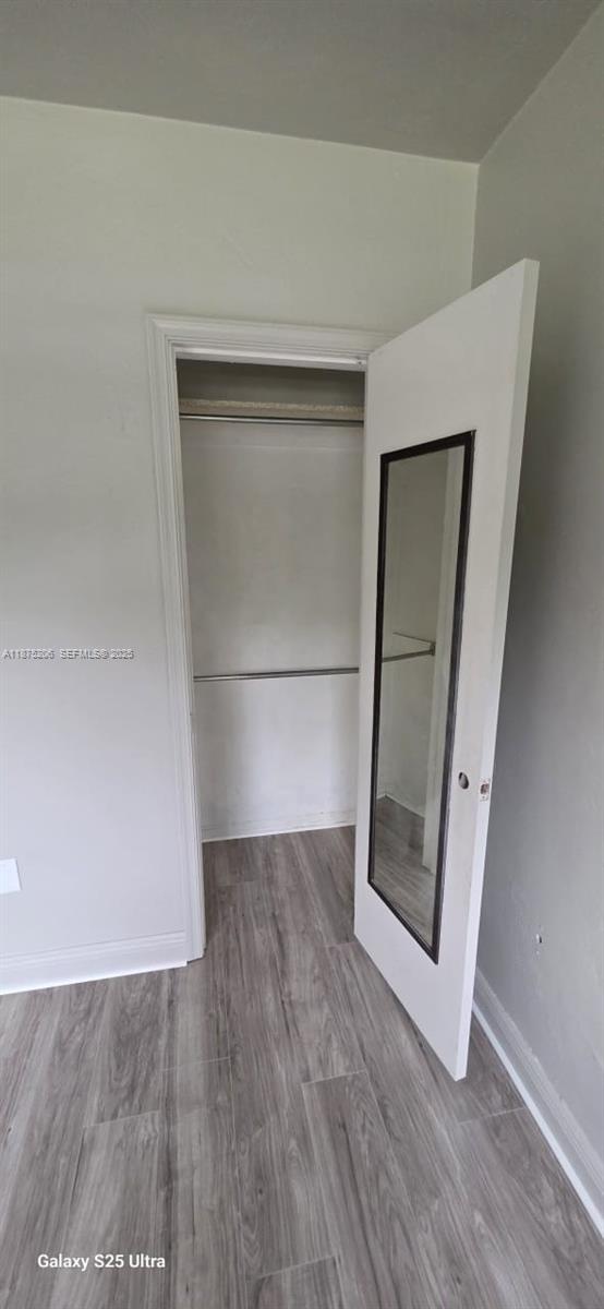 1340 Northwest 133rd Street Miami, FL 33167 - Photo 23 of 31 a view of a small space with wooden floor and a hallway