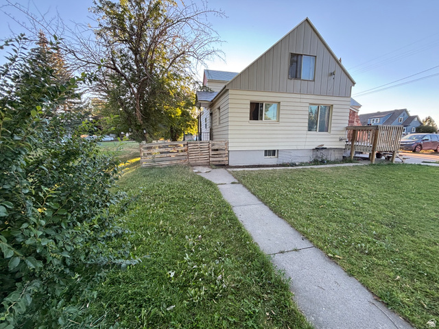 102 South Main Street Paris, ID 83261 - Photo 2 of 33 View of front of home featuring a front yard and board and batten siding